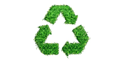 Symbole de recyclage composé de feuilles vertes représentant la durabilité et la protection de l’environnement.
